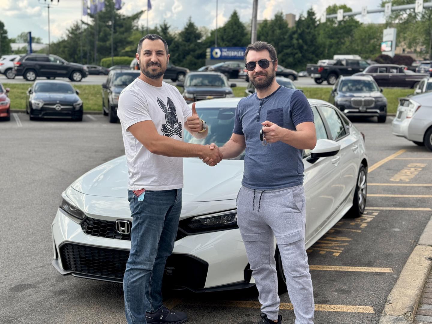 VIP Auto PA customer shaking hands after a lease approval
