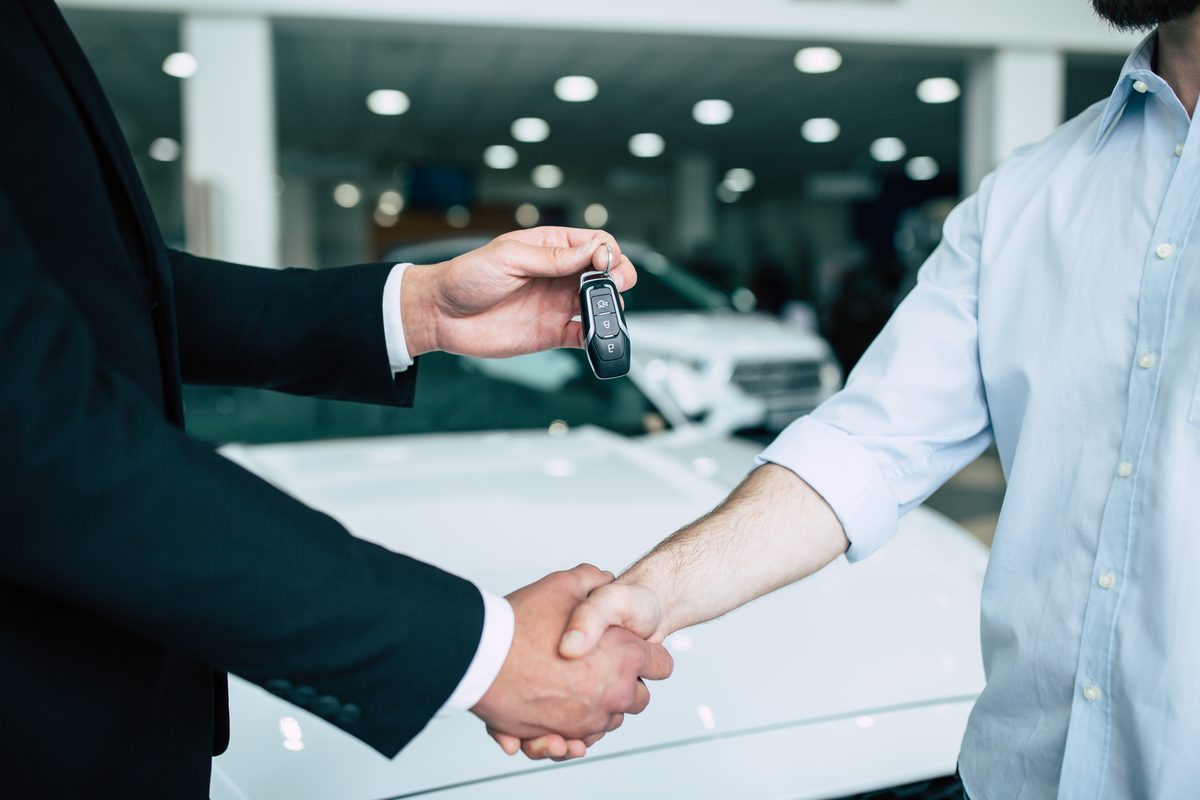 Handing over keys after finalizing a car lease agreement in Feasterville-Trevose